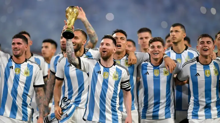 Colombia national football team poses for a photo in team jerseys during a match.