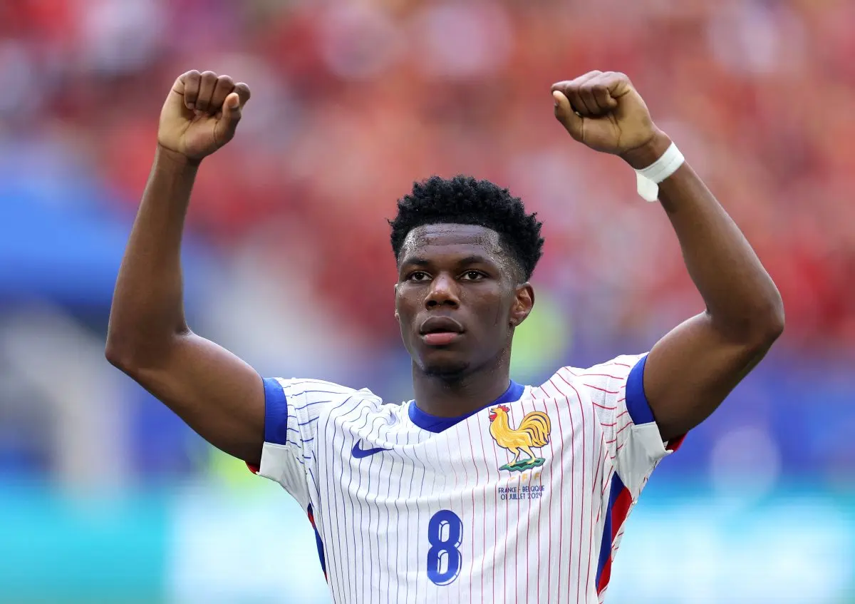 Aurelien Tchouameni celebrating in a France national team jersey during a match.
