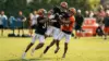 Cincinnati Bengals training camp practice with defenders competing intensely against receivers
