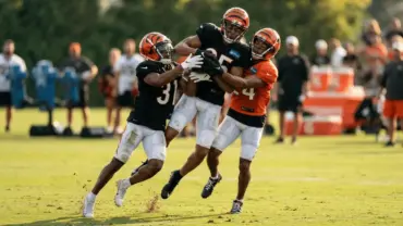 Cincinnati Bengals training camp practice with defenders competing intensely against receivers