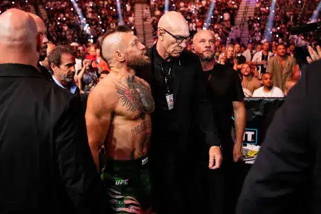 Conor McGregor at UFC 329, surrounded by security before his fight.
