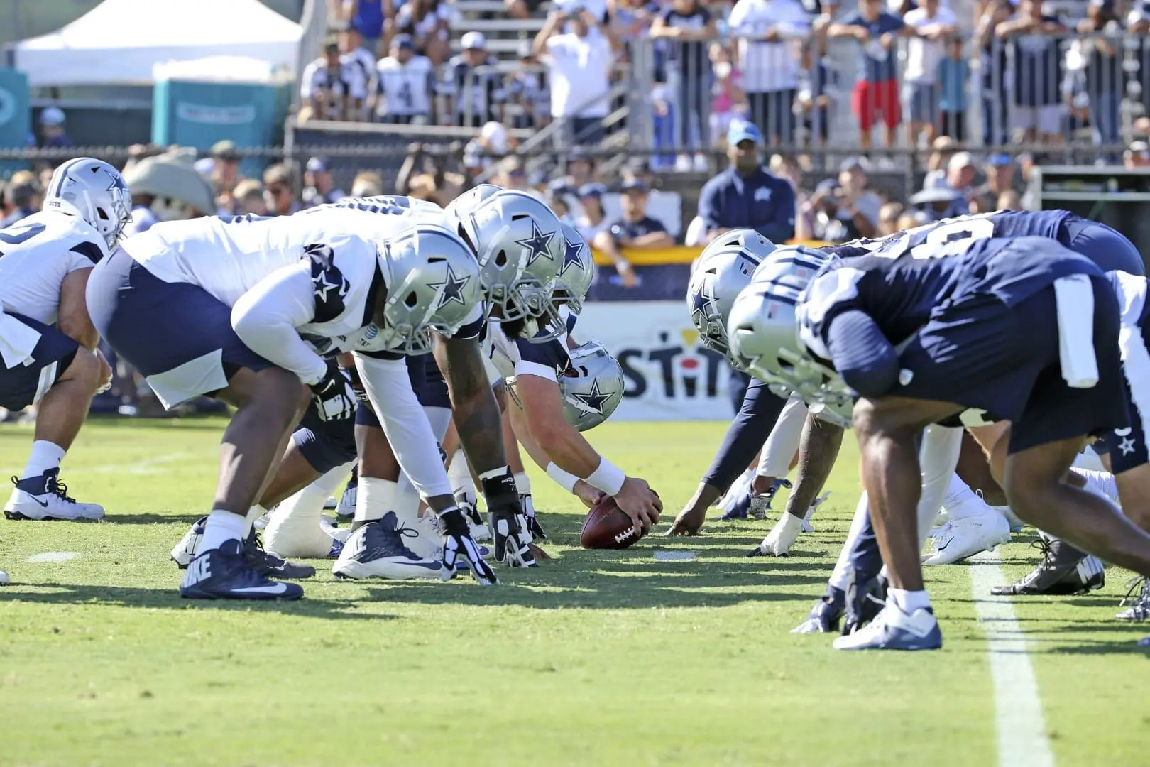 Dallas Cowboys players lined up for a play during training camp practice.