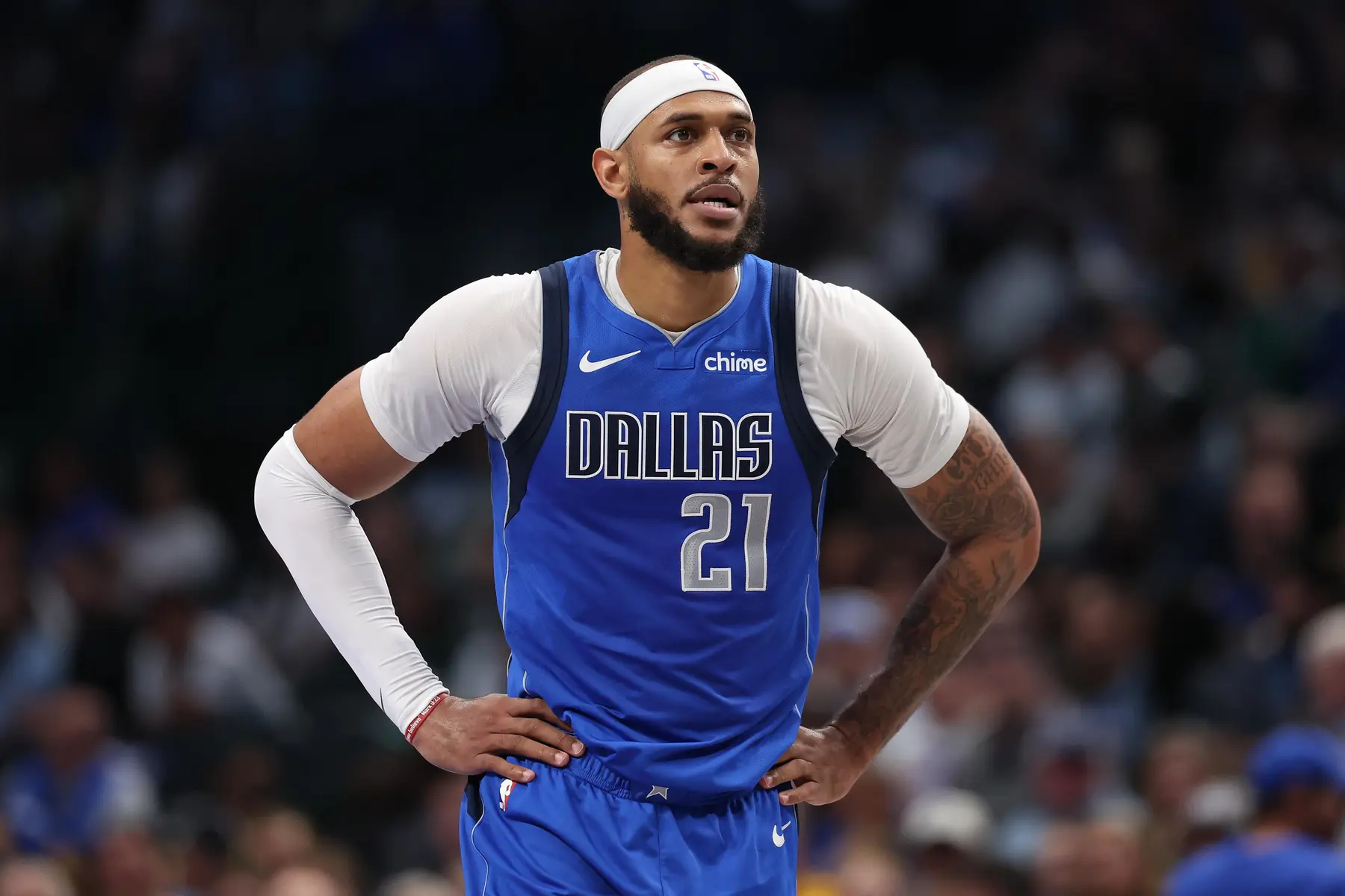 Dallas Mavericks player wearing blue jersey with 'Dallas' and number 21.