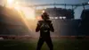 NFL quarterback in Browns uniform holding football in stadium, dramatic lighting and silhouette composition