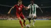 Switzerland and Algeria soccer players competing for ball during intense World Cup knockout match
