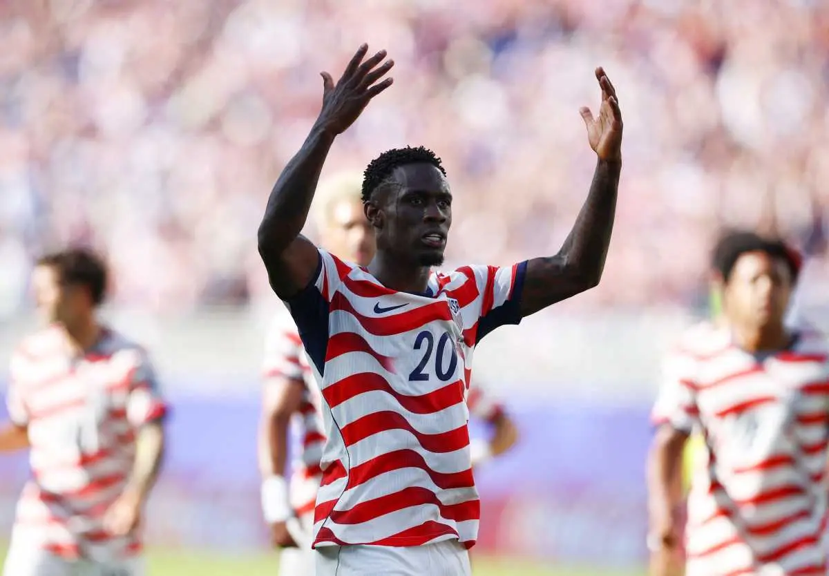 Folarin Balogun wearing a USA soccer jersey during a match.