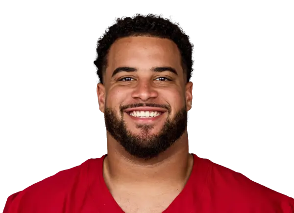 Isaiah Adams, Arizona Cardinals player, smiling in a team jersey.