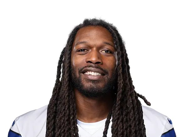 Jadeveon Clowney in a Dallas Cowboys uniform, smiling at the camera.