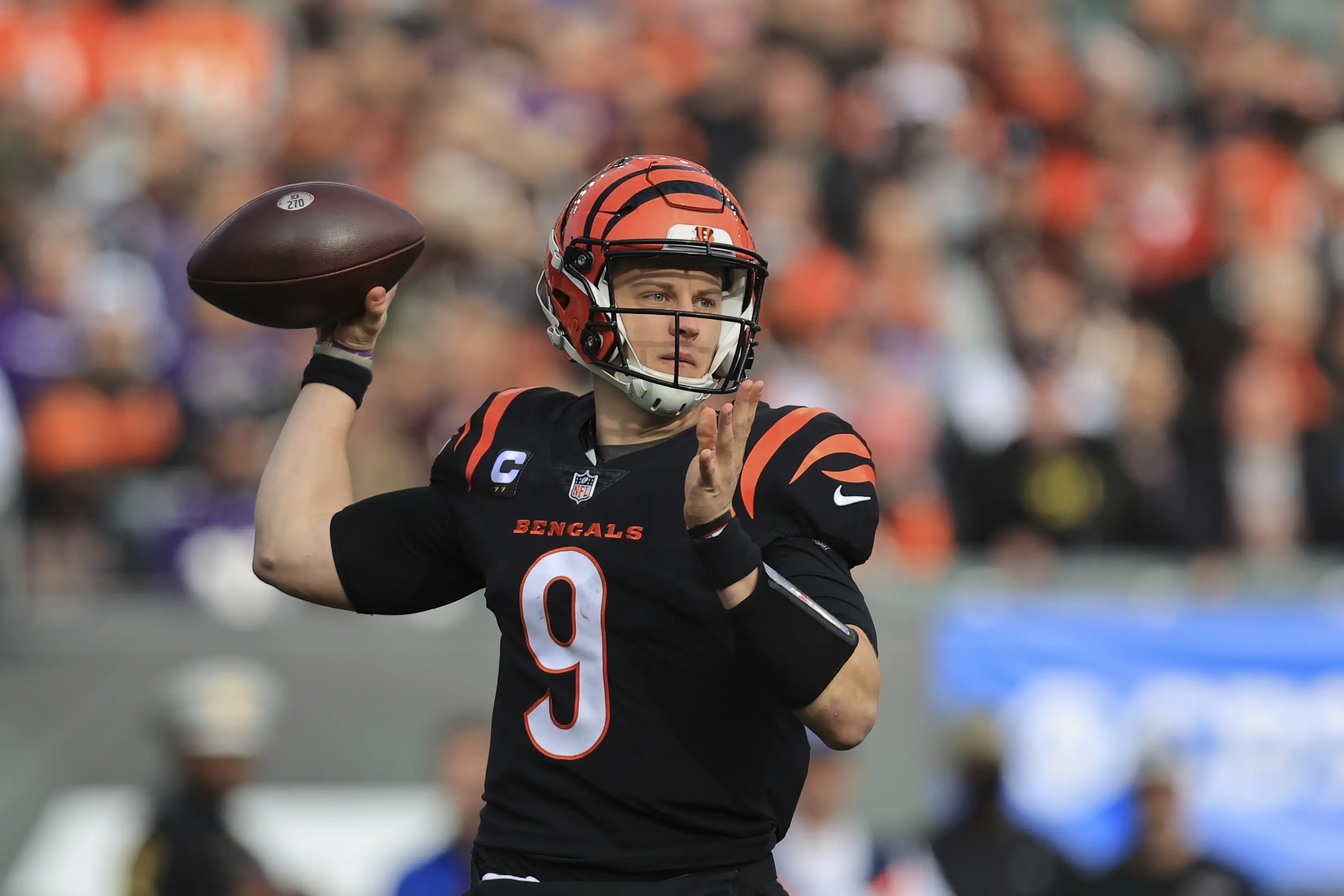 Cincinnati Bengals quarterback Joe Burrow prepares to throw a pass during a game.