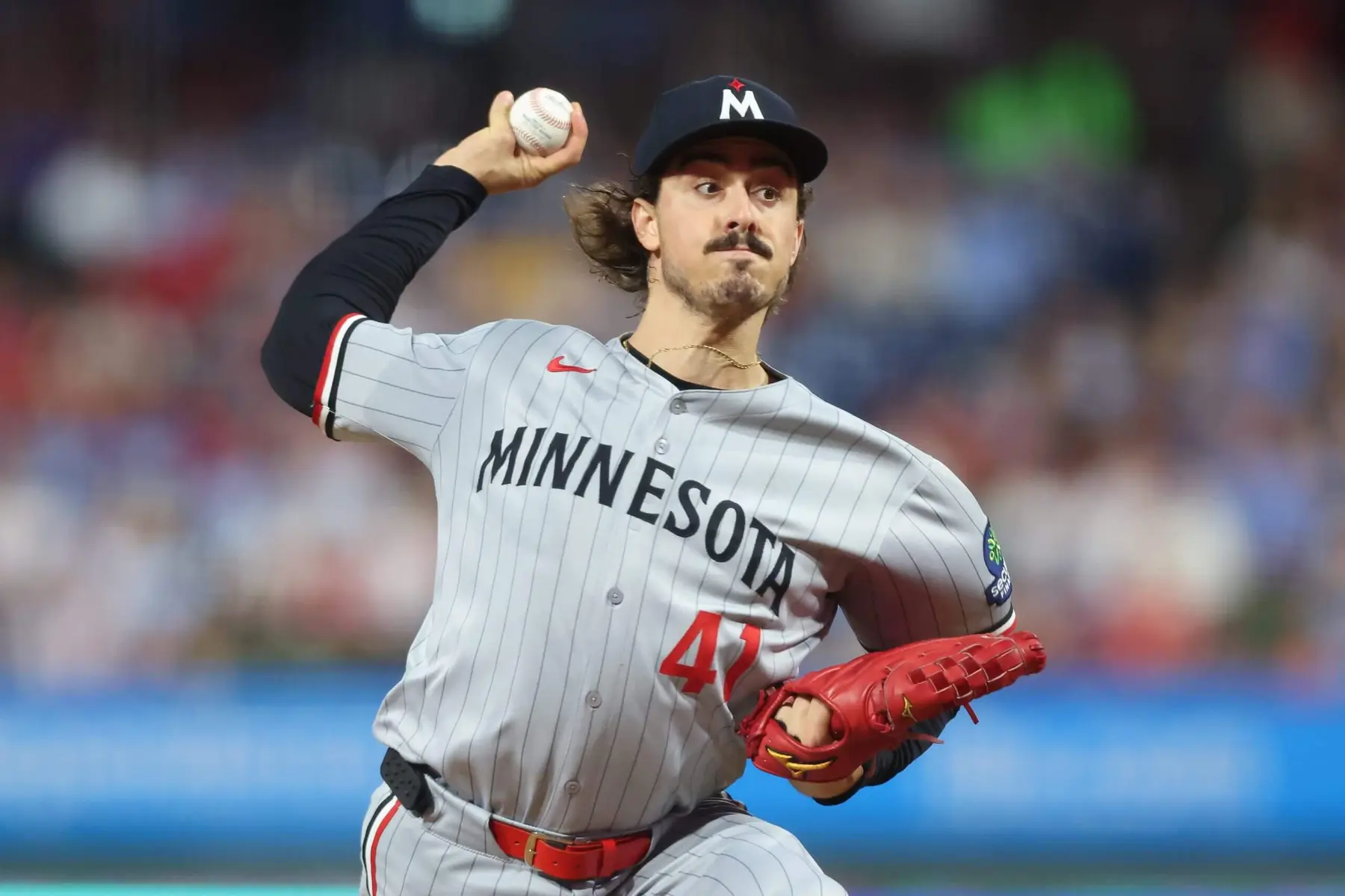 Minnesota Twins pitcher Joe Ryan in action during a game, wearing a gray jersey.