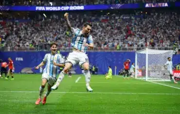 Lionel Messi and teammate celebrating Argentina's goal at FIFA World Cup 2026.