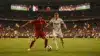 World Cup knockout stage soccer match with players competing for the ball under stadium lights