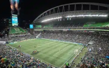 Lumen Field during a Seattle soccer match, crowded stands and bright lights.