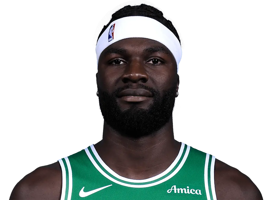 Headshot of Neemias Queta wearing a Boston Celtics green jersey and white headband
