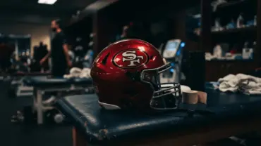 San Francisco 49ers helmet on training table representing Nick Bosa's contract and injury recovery situation