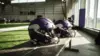 Two Minnesota Vikings helmets on practice facility bench symbolizing quarterback competition