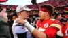Patrick Mahomes and Joe Burrow embrace post-game with fans and media around them.