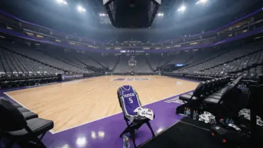 Sacramento Kings basketball court with purple team colors and bench area in professional NBA arena
