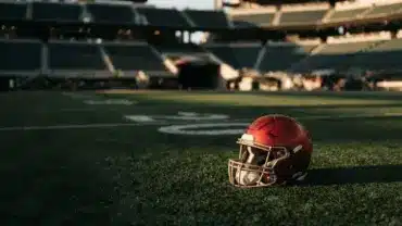 San Francisco 49ers helmet on stadium turf symbolizing roster decisions and team transitions