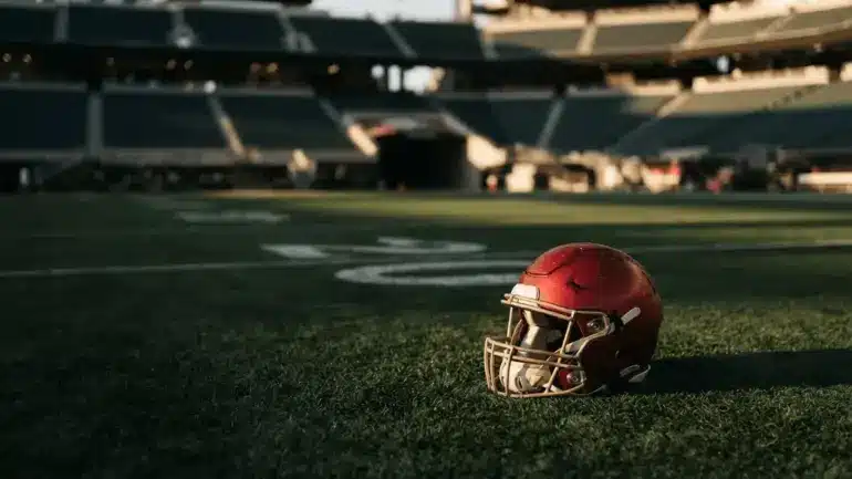 San Francisco 49ers helmet on stadium turf symbolizing roster decisions and team transitions