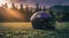 NFL helmet on practice field with evergreen trees, representing Jadeveon Clowney's potential signing destination