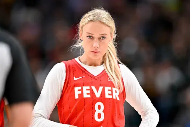 Sophie Cunningham in a red Fever jersey during a basketball game.