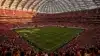 SoFi Stadium interior during World Cup match with dramatic lighting and packed crowd in red and white