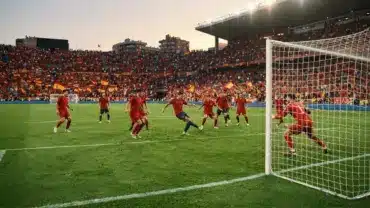 Spain vs Belgium World Cup quarter-final match action in packed stadium with dramatic lighting