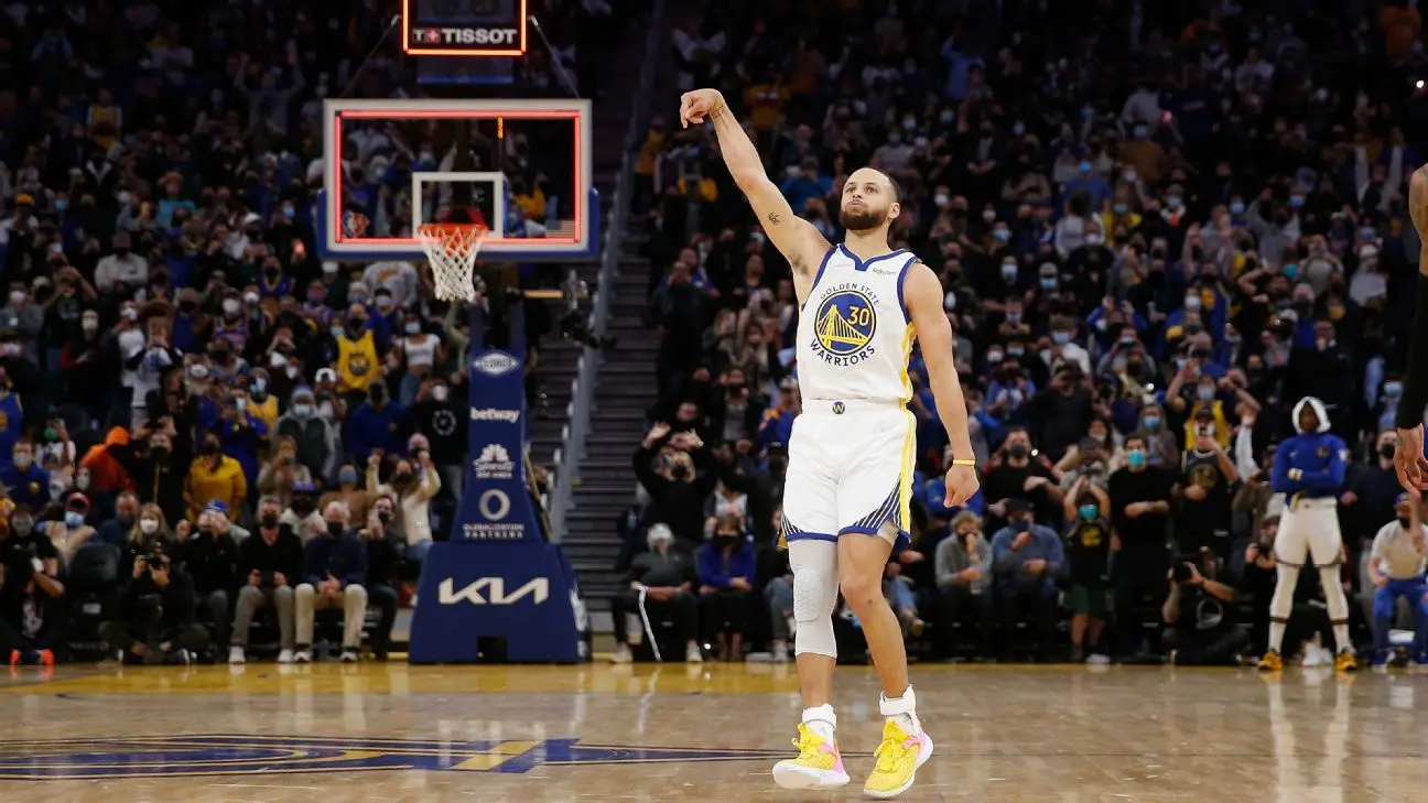 Stephen Curry of the Golden State Warriors gesturing on the basketball court during a game.
