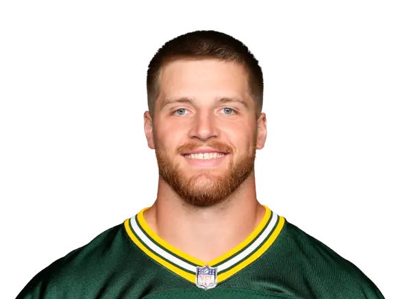 Portrait of a football player in a green and yellow Packers jersey.