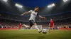 USA striker taking powerful shot during World Cup knockout match at packed Lumen Field stadium