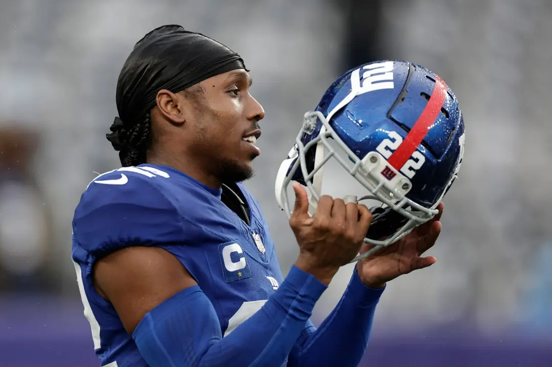 Adoree Jackson in a New York Giants jersey holding his blue football helmet
