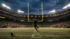 NFL-style kicker attempts a field goal under stadium lights, symbolizing the Saints' unsettled kicking competition