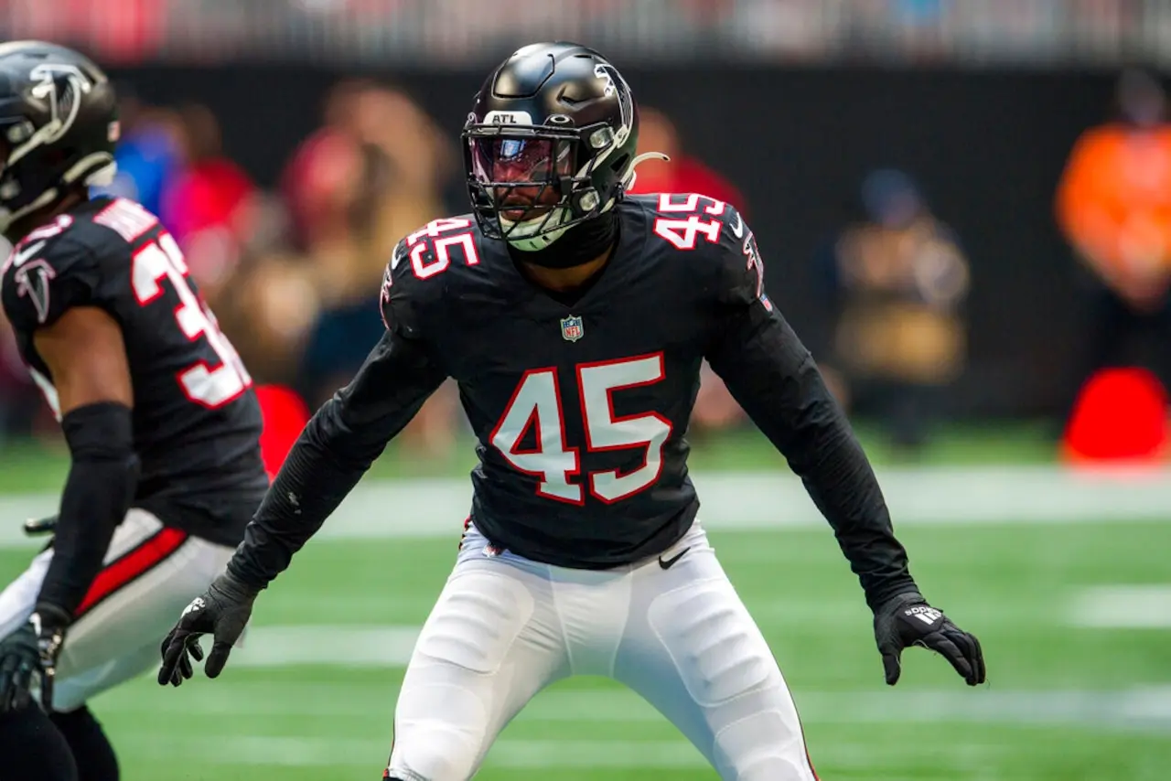 Deion Jones of the Atlanta Falcons wearing jersey number 45 in a defensive stance during a game.