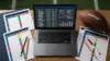 Fantasy football draft workstation with rankings sheets, projections and a football
