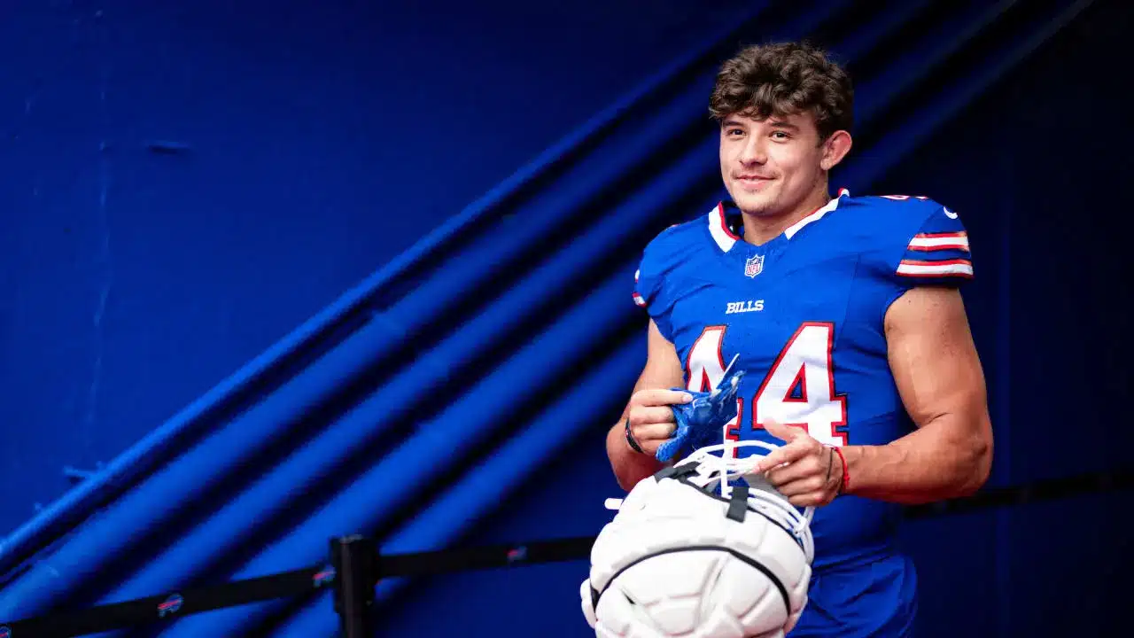 Buffalo Bills player Joe Andreessen wearing a blue jersey and holding a white football