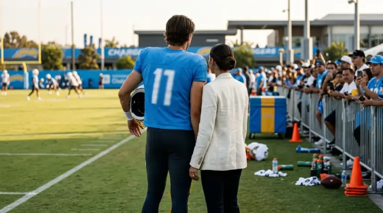 Justin Herbert and his fiancée at a Chargers training camp practice
