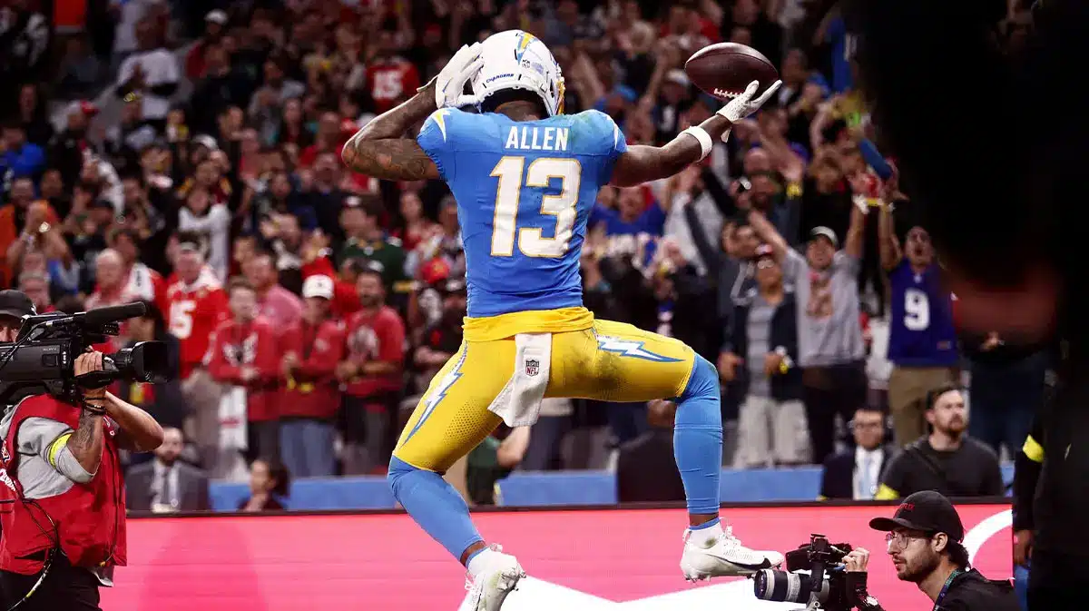 Keenan Allen of the Los Angeles Chargers celebrating a catch with a football in hand during a game.