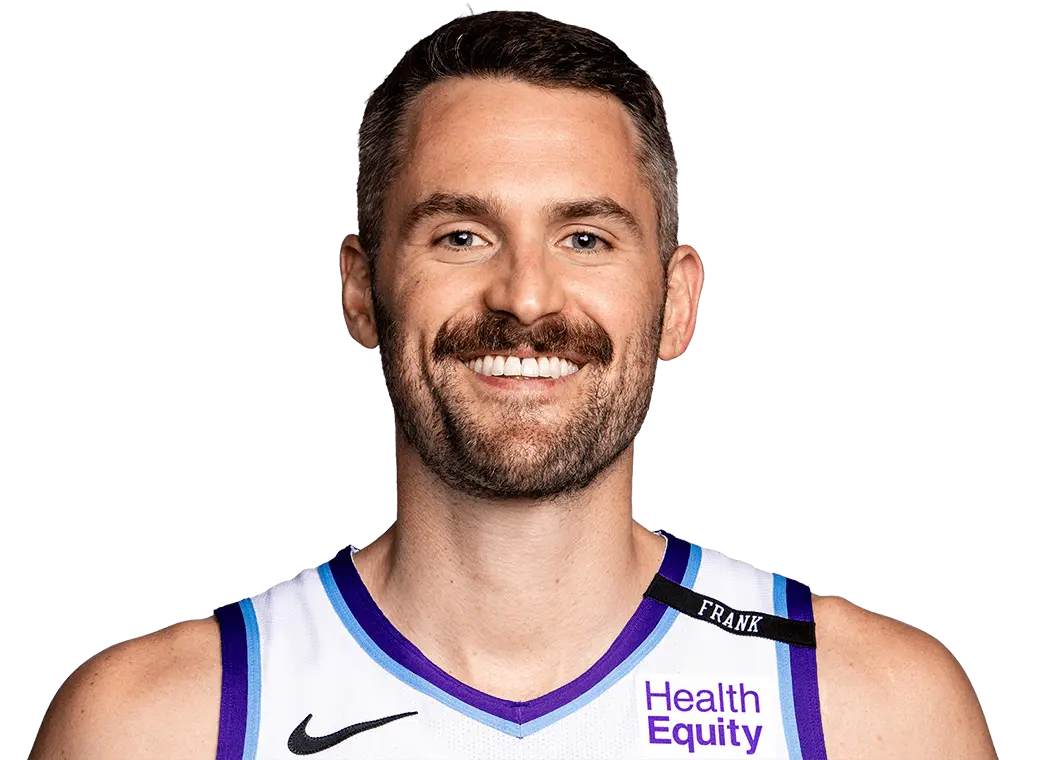 Headshot of NBA player Kevin Love wearing a white and purple Charlotte Hornets jersey.