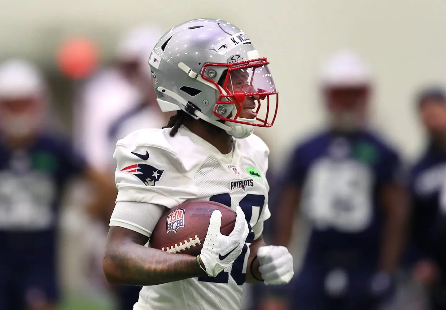 New England Patriots wide receiver Kyle Williams carrying a football during practice