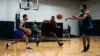 Three basketball players build chemistry during an intense 3-on-3 workout in a Los Angeles gym