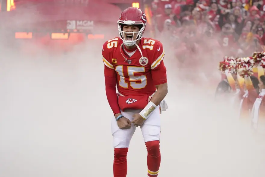 Patrick Mahomes of the Kansas City Chiefs shouting in celebration on a smoke-filled field