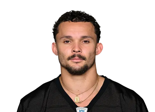 Headshot of Roman Wilson wearing a black Pittsburgh Steelers jersey and gold necklaces.