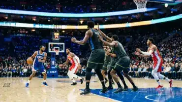 Philadelphia 76ers-inspired star lineup facing a defensive test in a dramatic basketball arena