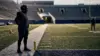 NFL free-agent tackle silhouette on a football field during training camp