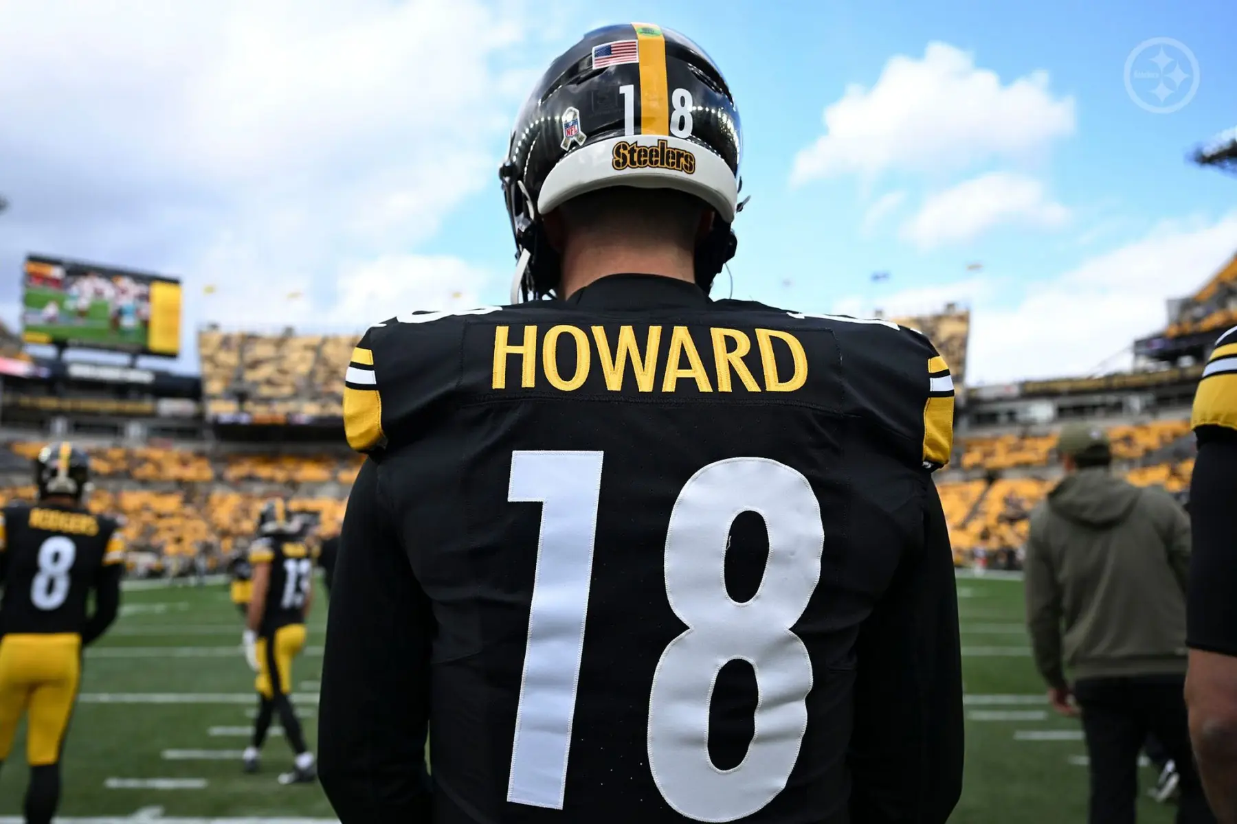 Rear view of Pittsburgh Steelers quarterback Will Howard wearing a black and yellow jersey with number 18